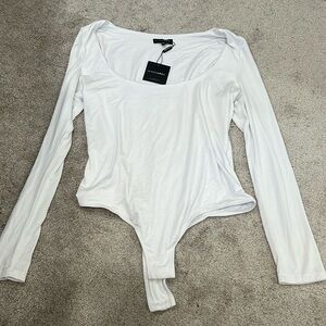 Brand new w/tags white long sleeve bodysuit. Size XXL